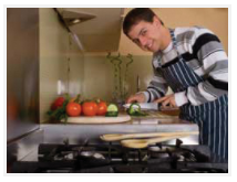 Teen smiling while cooking